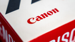 Canon logo on a red printed surface – long-standing Melville Brand Design client