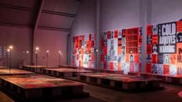 Slanted – design publication exhibition with posters in a red-lit room