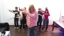 Video still: group of dancers performing in a studio